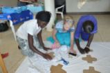 Training and employing some of the hotel staff to cut and sew pads while we are away doing wound care, playing with the children, and sharing the love of Jesus at another village.